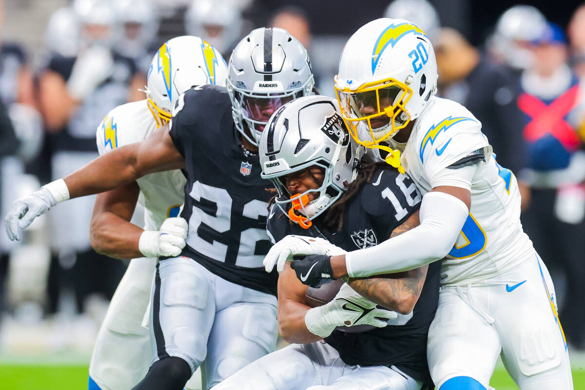 Raiders wide receiver Jakobi Meyers (16) forces his way down the field as Los Angeles Chargers ...