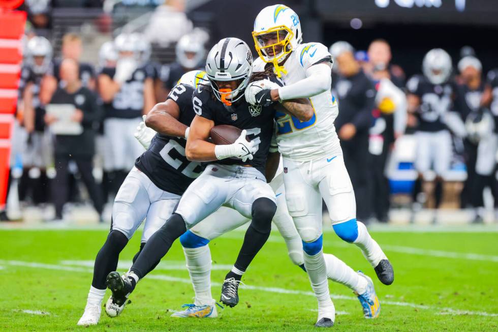 Raiders wide receiver Jakobi Meyers (16) forces his way down the field as Los Angeles Chargers ...