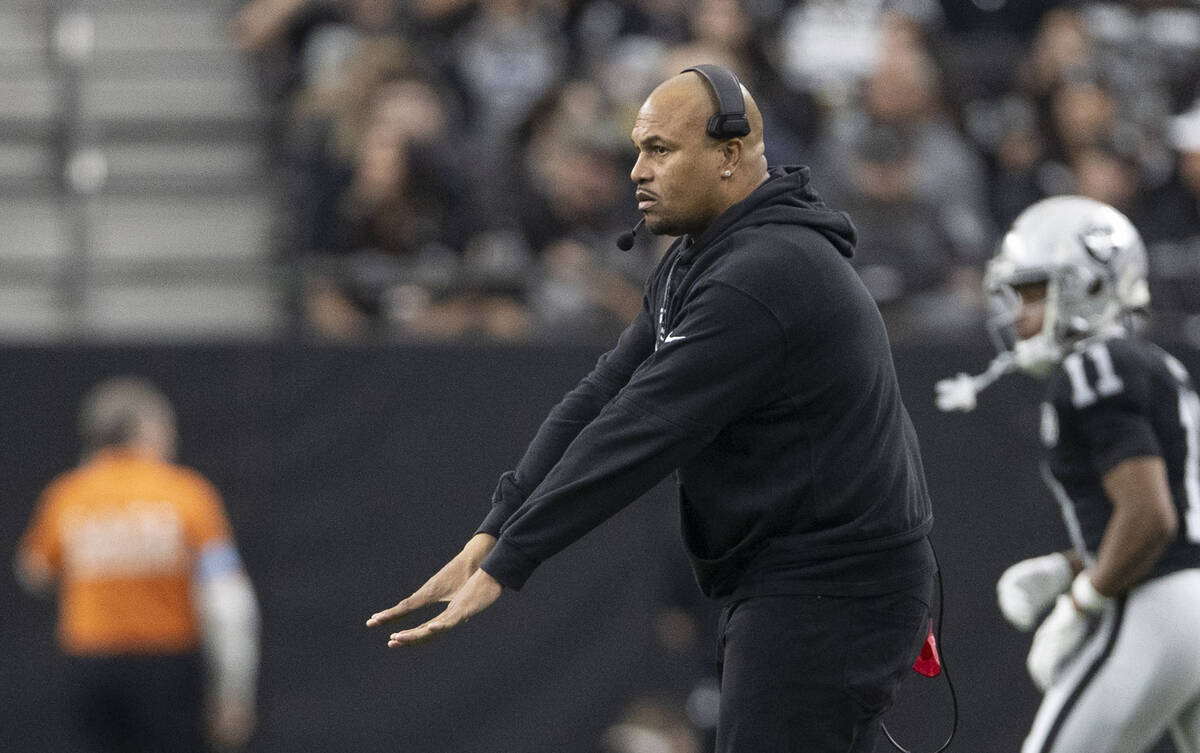 Raiders head coach Antonio Pierce gestures from the sideline during the first half of an NFL ga ...