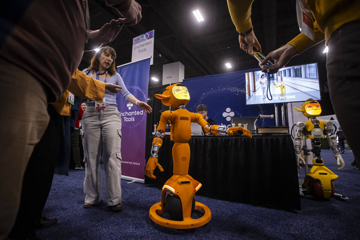 Miroka, a robot by Enchanted Tools, interacts with attendees during CES Unveiled on the first m ...