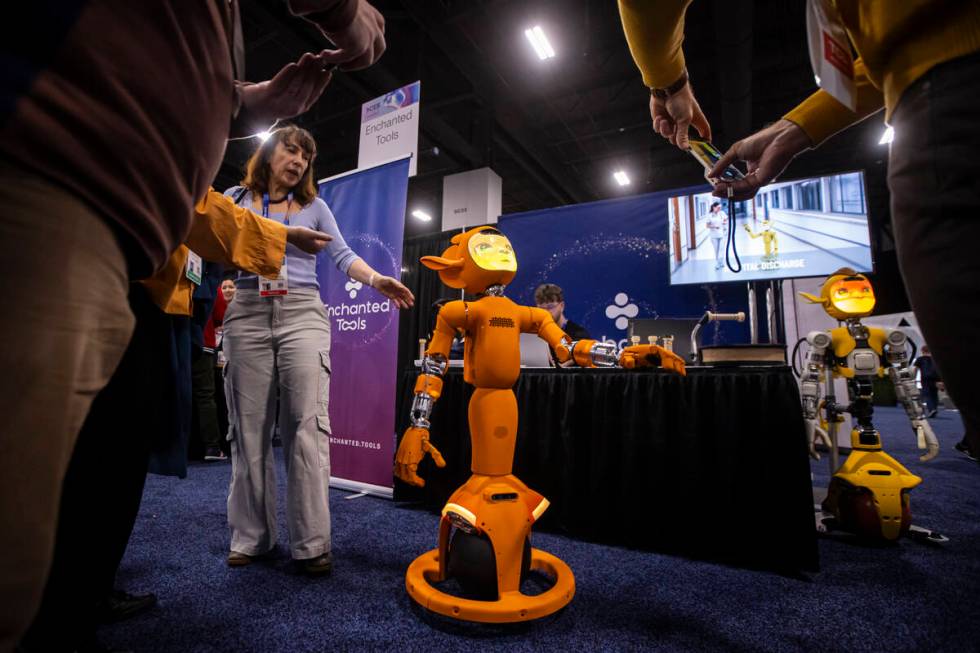 Miroka, a robot by Enchanted Tools, interacts with attendees during CES Unveiled on the first m ...