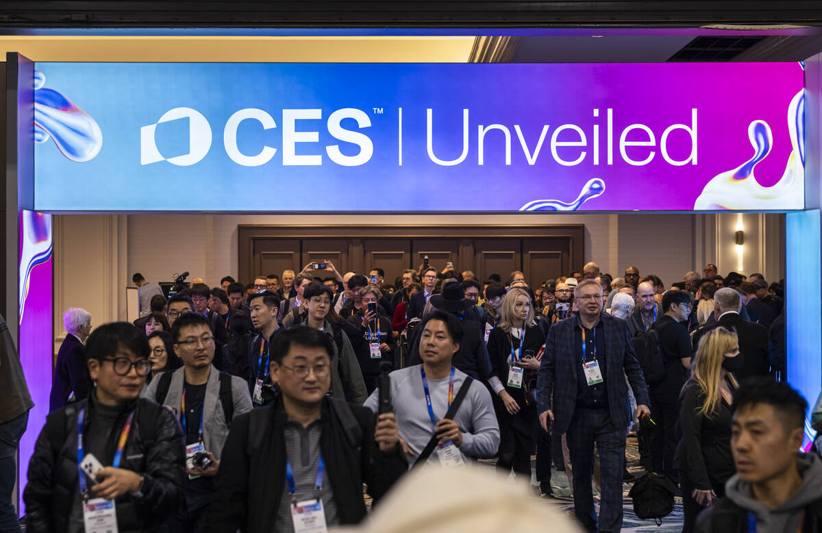 Attendees arrive to CES Unveiled on the first media day of the annual international consumer el ...