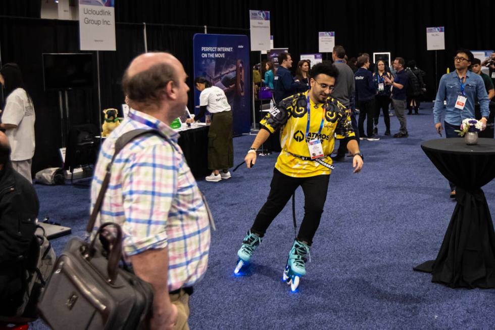 Mido Soliman, who founded AtmosGear, shows off the company's electric skates during CES Unveile ...