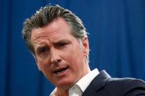 California Gov. Gavin Newsom answers a question during a news conference in Sacramento, Calif. ...