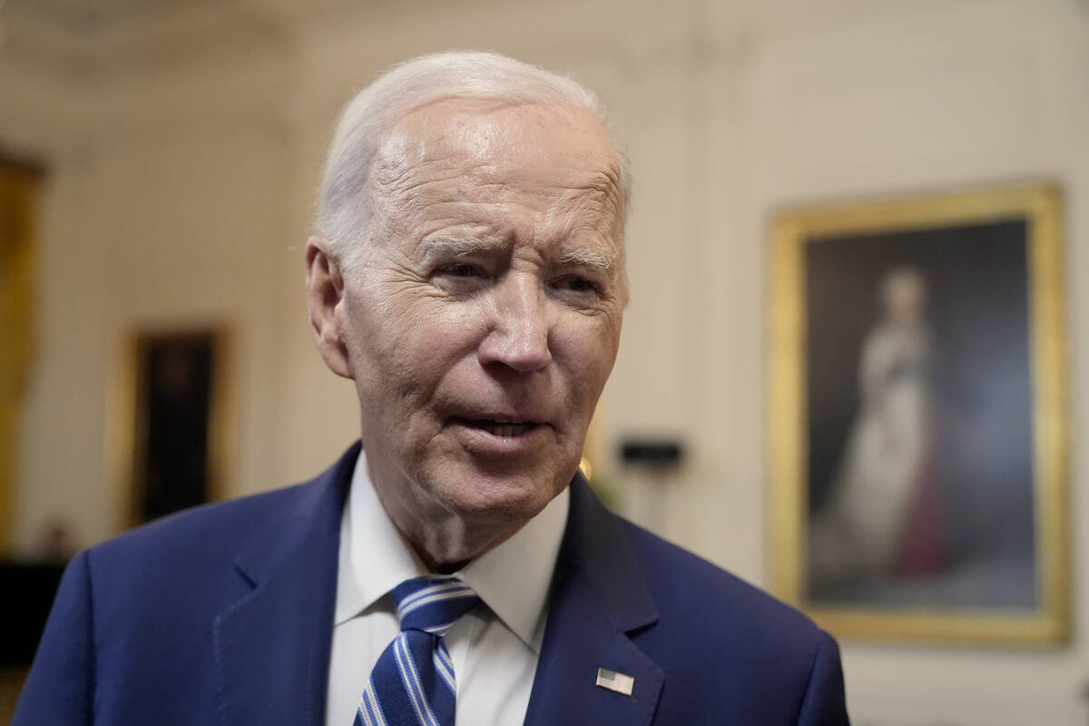 President Joe Biden speaks with reporters after signing the Social Security Fairness Act in the ...