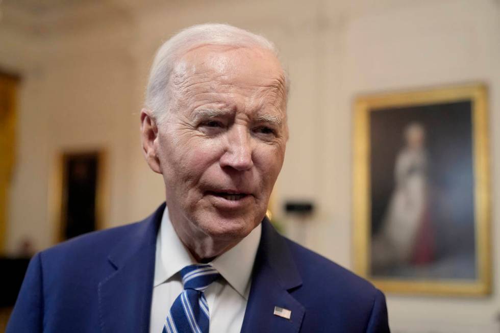 President Joe Biden speaks with reporters after signing the Social Security Fairness Act in the ...