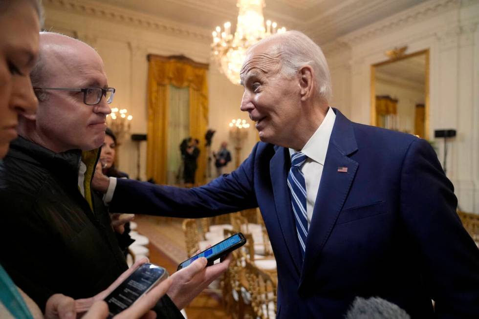 President Joe Biden speaks with reporters after signing the Social Security Fairness Act in the ...