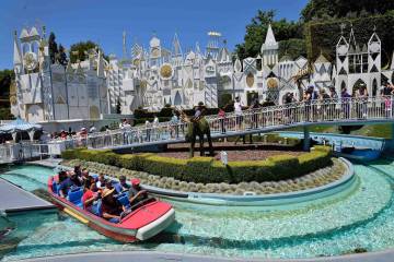 Disneyland visitors ride It’s a Small World in Fantasyland in Anaheim, California, on Ju ...