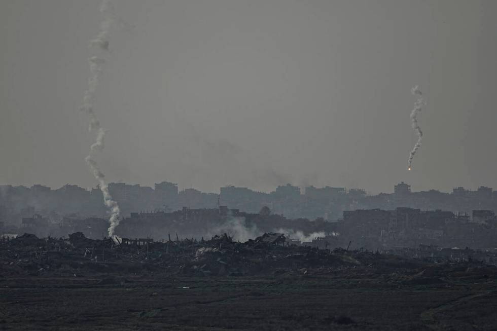 An Israeli army flare is seen over the Gaza Strip, as seen from Sderot, southern Israel, Monday ...