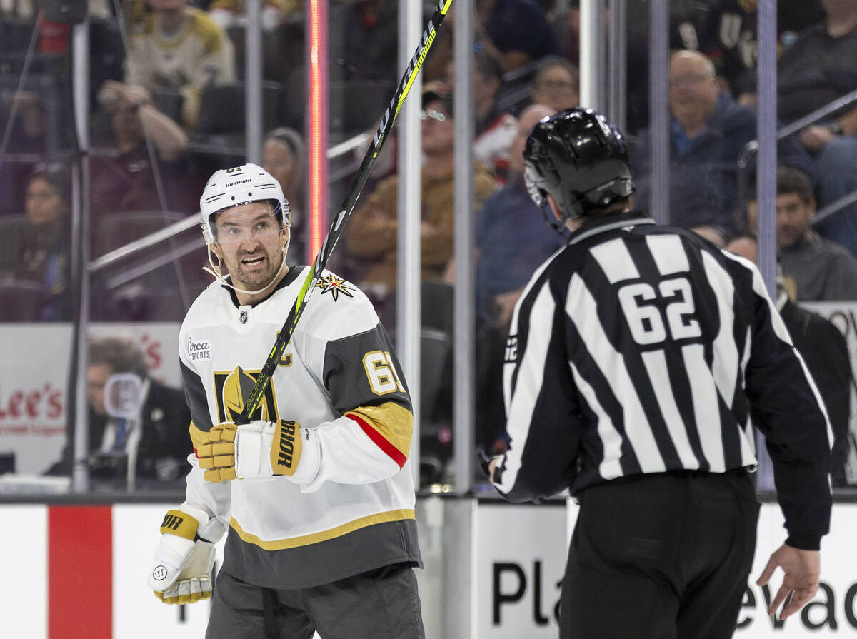 Golden Knights right wing Mark Stone (61) argues a call with a referee during the NHL hockey ga ...