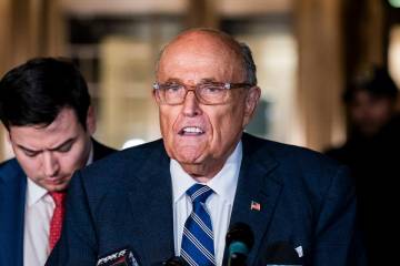 Rudy Giuliani speaks to the media outside of Manhattan federal court in New York, on Friday, Ja ...