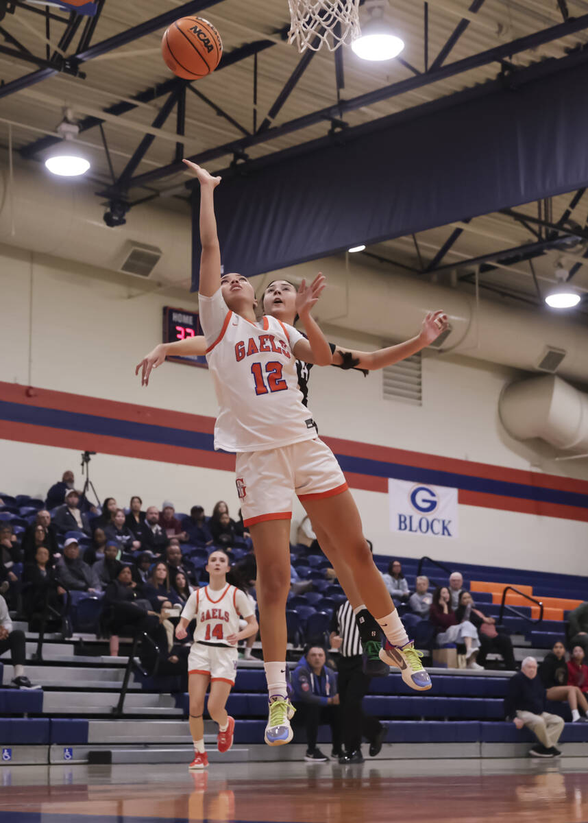 Bishop Gorman's Addysen Carr (12) lays up the ball against Faith Lutheran during a high school ...