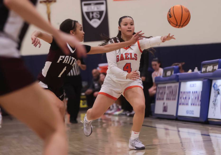 Bishop Gorman's Anna Barragan (4) throws a pass under pressure from Faith Lutheran's Jasmyn Jac ...