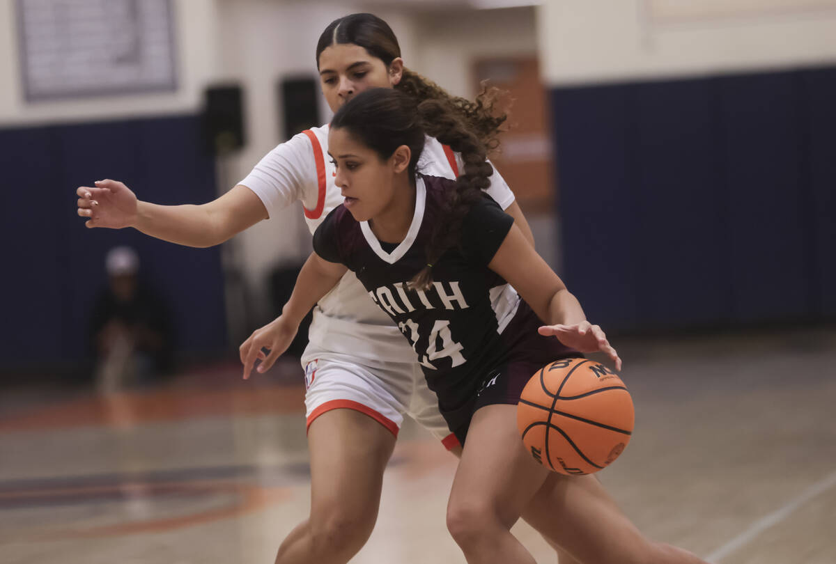 Faith Lutheran's Camryn Young (24) drives the ball against Bishop Gorman during a high school b ...