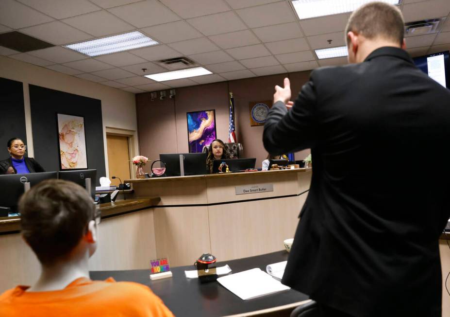 Judge Dee Smart Butler, left, listens as Ryan Helmick representing a 15-year-old boy, left, acc ...