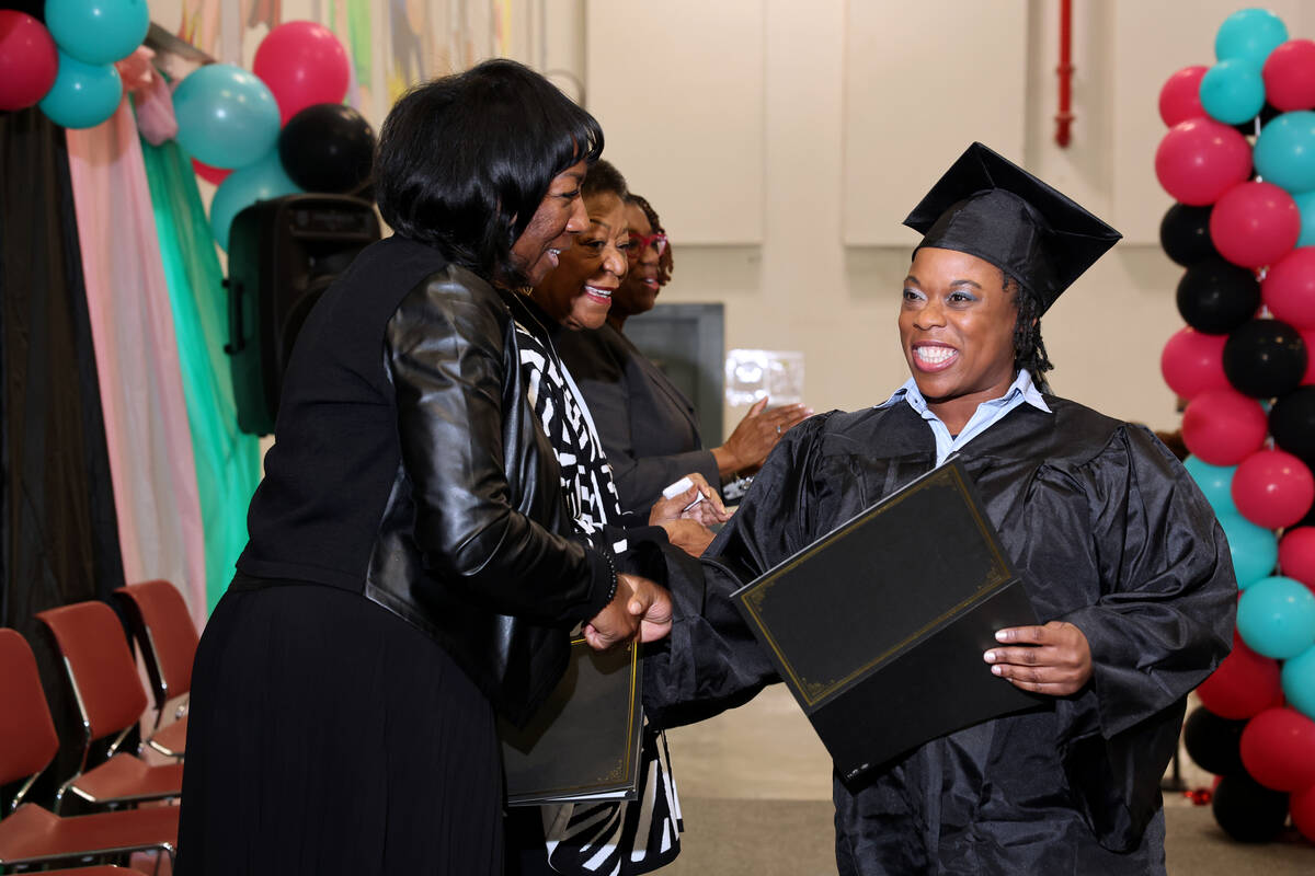 Myesha Young, an inmate at Florence McClure Women’s Correctional Center, receives her co ...