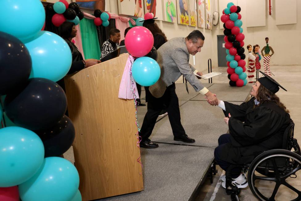 Betty Freed, an inmate at Florence McClure Women’s Correctional Center, receives her nai ...