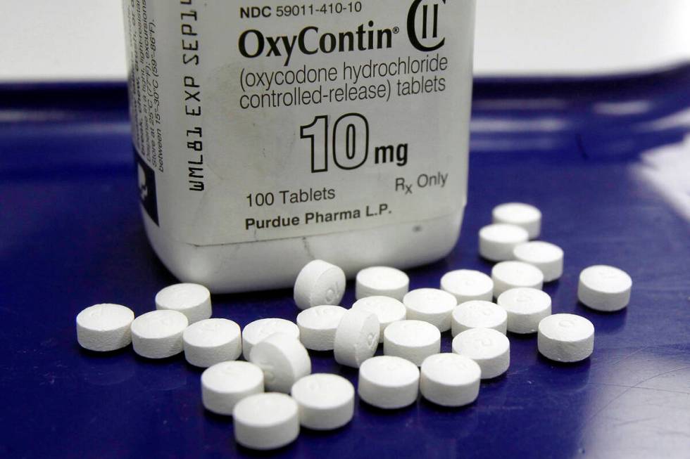 OxyContin pills arranged for a photo at a pharmacy, Feb. 19, 2013 in Montpelier, Vt. (AP Photo/ ...