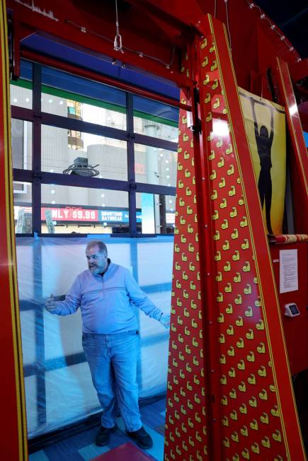 General Manager Chris Coley talks to a reporter about the opening-soon In The Game arcade busin ...