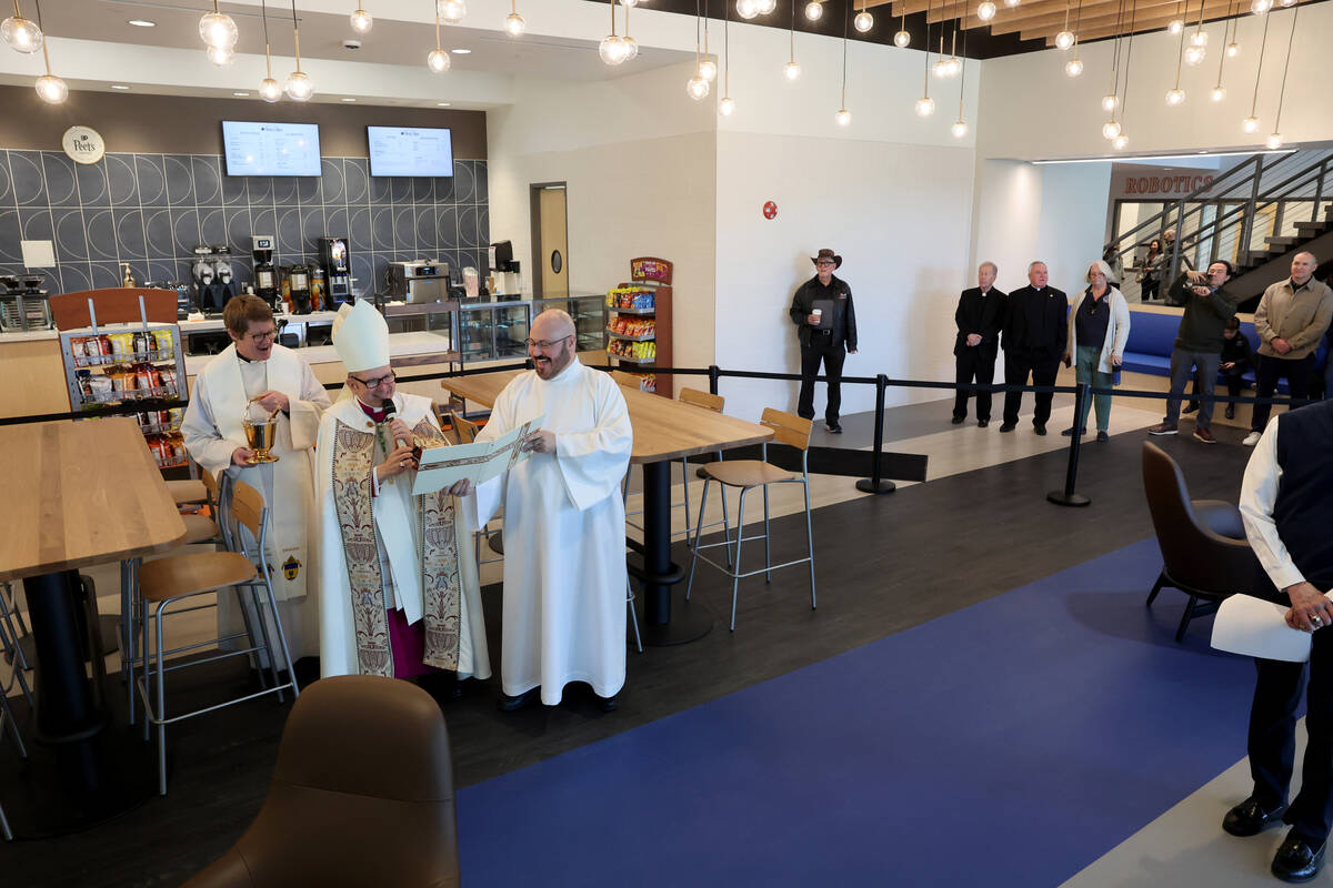 Bishop Greg Gordon, auxiliary bishop of the Archdiocese of Las Vegas, blesses the coffee shop a ...