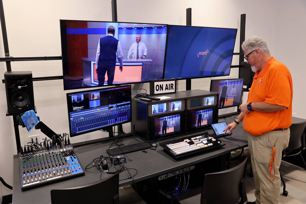 Broadcast media teacher Jason Valle shows the Broadcast Media Center during the opening ceremon ...