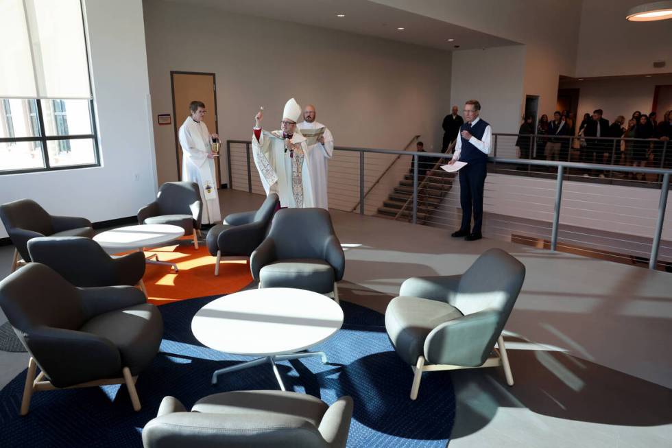 Bishop Greg Gordon, auxiliary bishop of the Archdiocese of Las Vegas, blesses the atrium at the ...