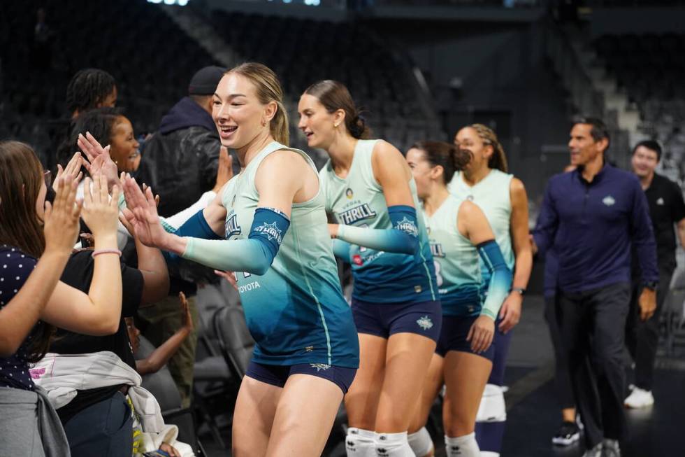 Vegas Thrill outside hitter Hannah Maddux gives out high-fives at Lee's Family Forum. (Vegas Th ...