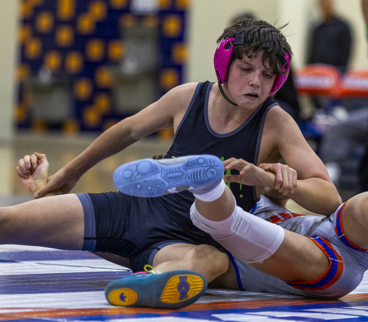 SLAM's Eric Bice, left, gets control on the mat with Bishop Gorman's Elijah Tabasa during their ...