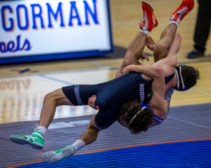 SLAM's Drake Hooiman, left, upends Bishop Gorman's Cash Hairston on a takedown during their 144 ...