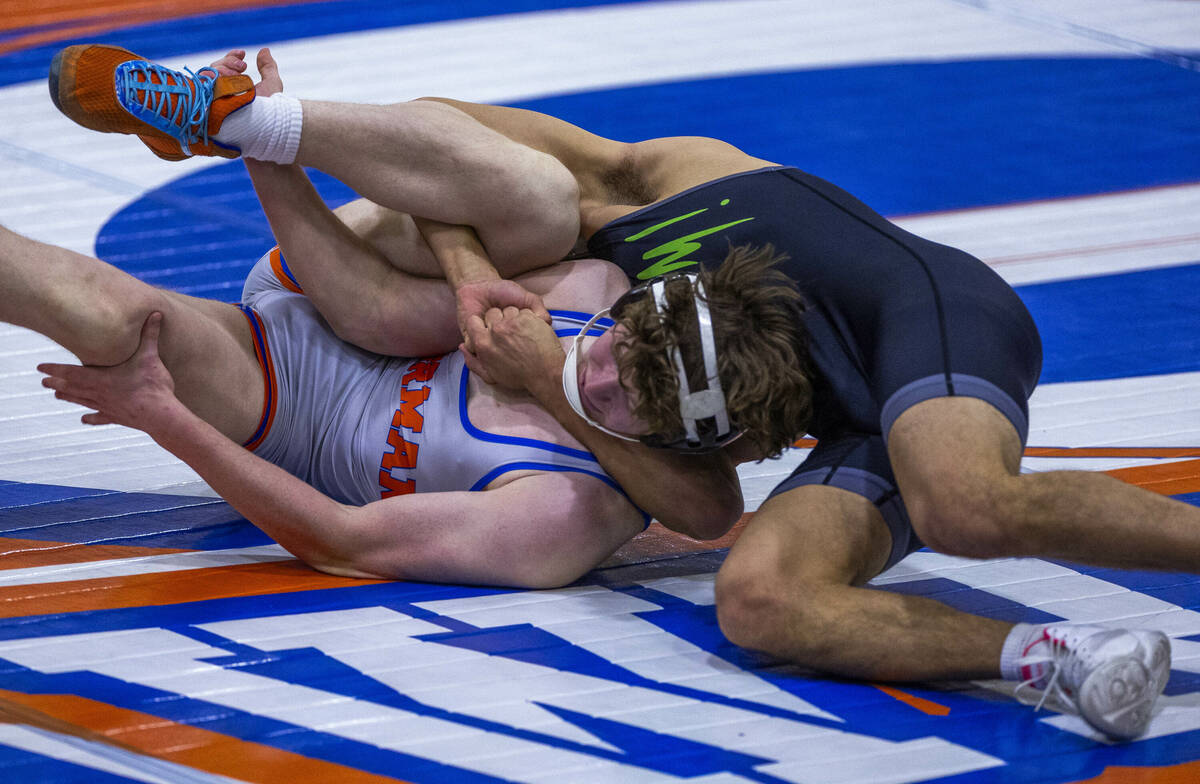 Bishop Gorman's Harrison Smith, front, is controlled by SLAM's Gabe Delgado during their 165 po ...