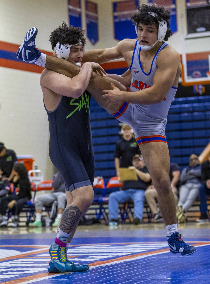 SLAM's Satoshi Davis, left, works to upend Bishop Gorman's Kage Mir during their 190 pound NIAA ...