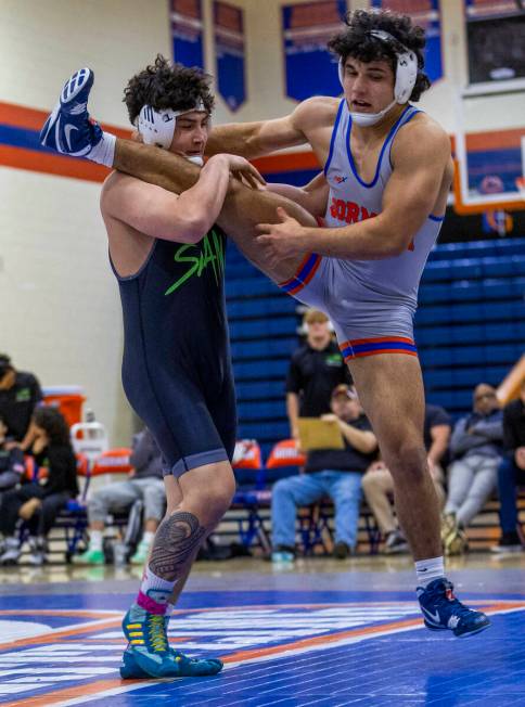 SLAM's Satoshi Davis, left, works to upend Bishop Gorman's Kage Mir during their 190 pound NIAA ...