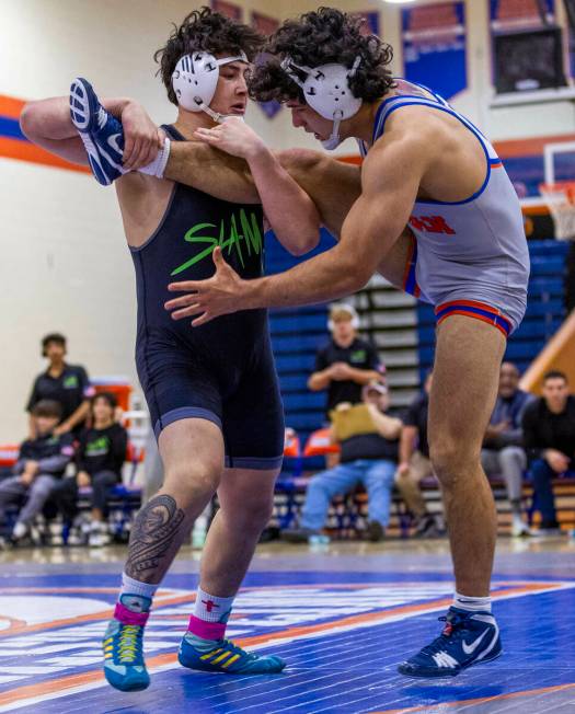 SLAM's Satoshi Davis, left, works to upend Bishop Gorman's Kage Mir during their 190 pound NIAA ...