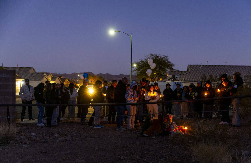 Candles light up as family and friends gather during a vigil for Jennaleah Hin, 17, who was fou ...