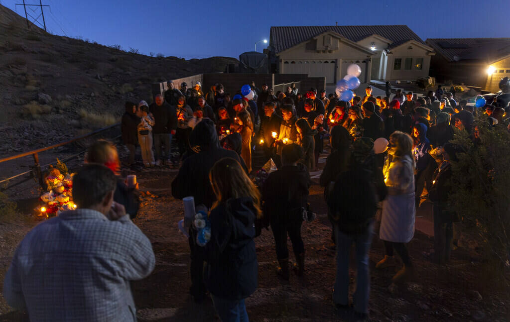 Family and friends gather during a vigil for Jennaleah Hin, 17, who was found dead on Jan. 5, 2 ...