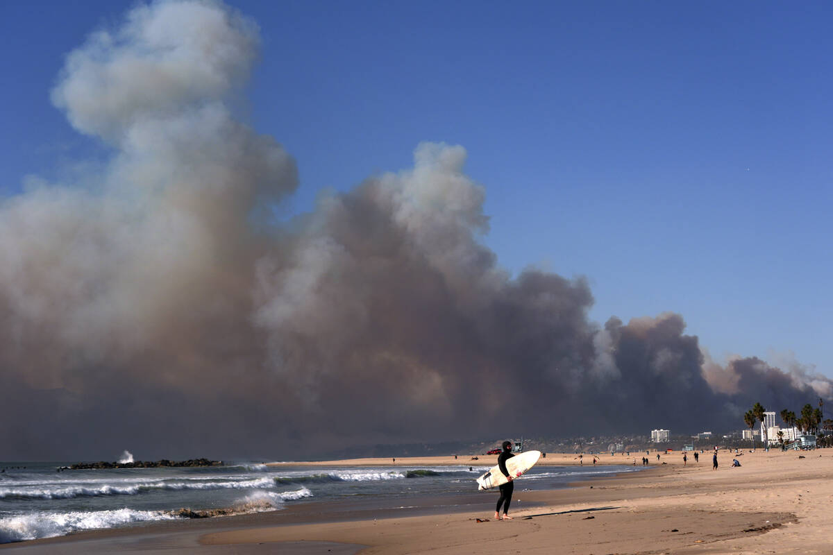 Smoke from a wildfire is seen from the Venice Beach section of Los Angeles, Tuesday, Jan. 7, 20 ...