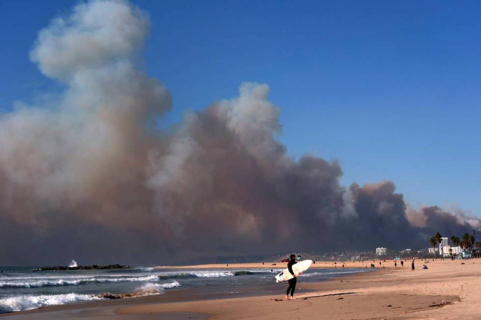 Smoke from a wildfire is seen from the Venice Beach section of Los Angeles, Tuesday, Jan. 7, 20 ...