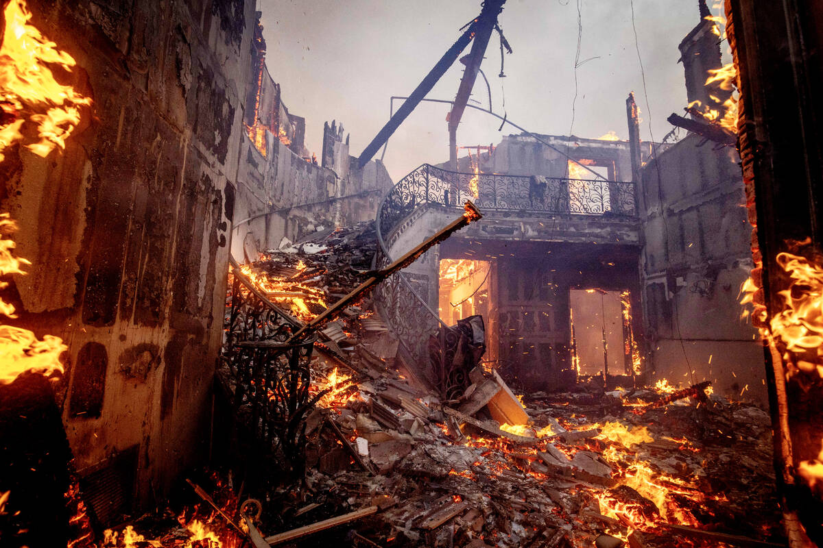 The Palisades Fire burns a residence in the Pacific Palisades neighborhood of Los Angeles, Tues ...