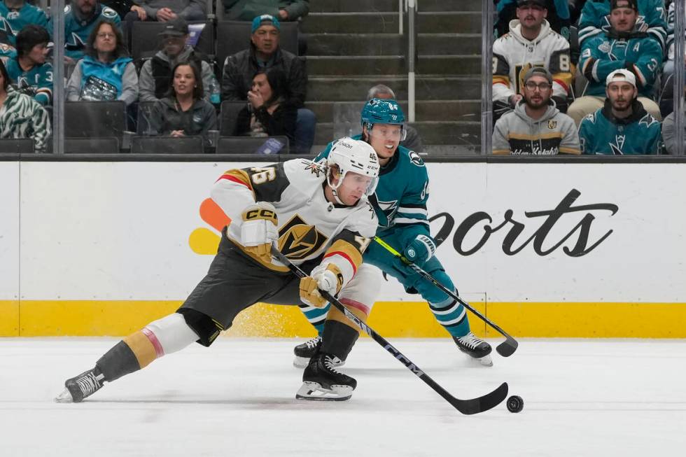 Vegas Golden Knights right wing Jonas Rondbjerg, foreground, skates toward the puck against San ...