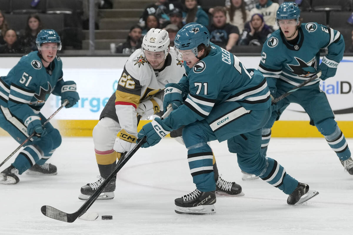 San Jose Sharks center Macklin Celebrini (71) reaches for the puck next to Vegas Golden Knights ...