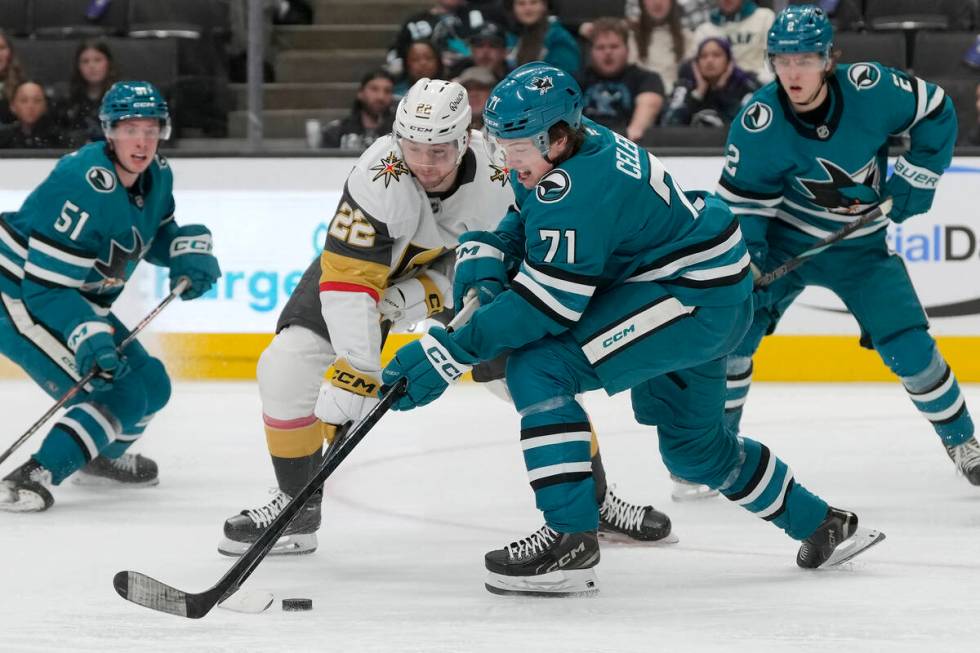 San Jose Sharks center Macklin Celebrini (71) reaches for the puck next to Vegas Golden Knights ...