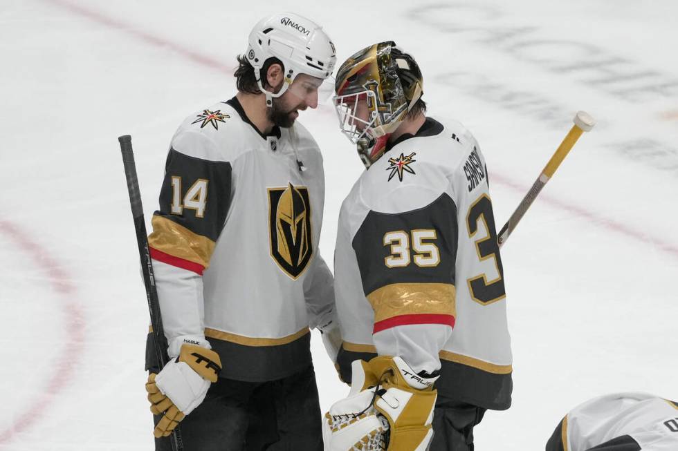 Vegas Golden Knights defenseman Nicolas Hague (14) celebrates with goaltender Ilya Samsonov (35 ...