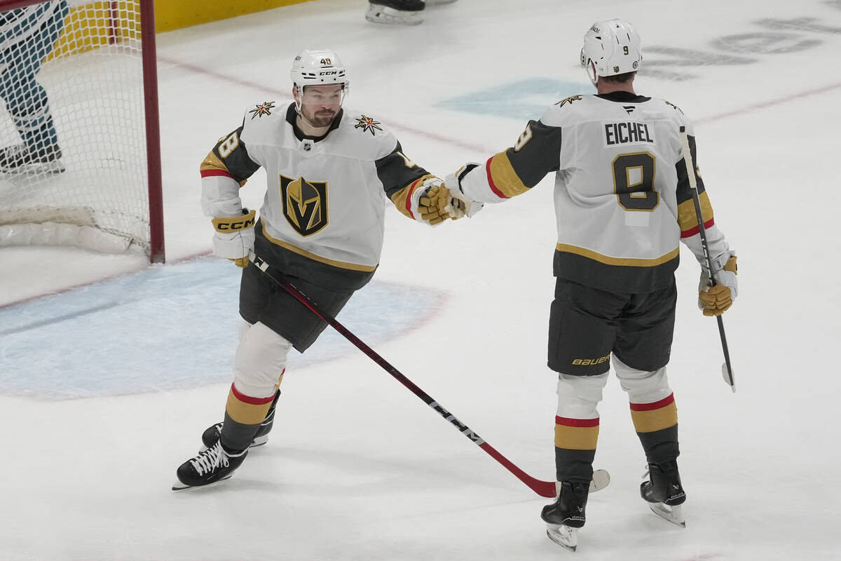 Vegas Golden Knights center Tomas Hertl, foreground left, is congratulated by center Jack Eiche ...