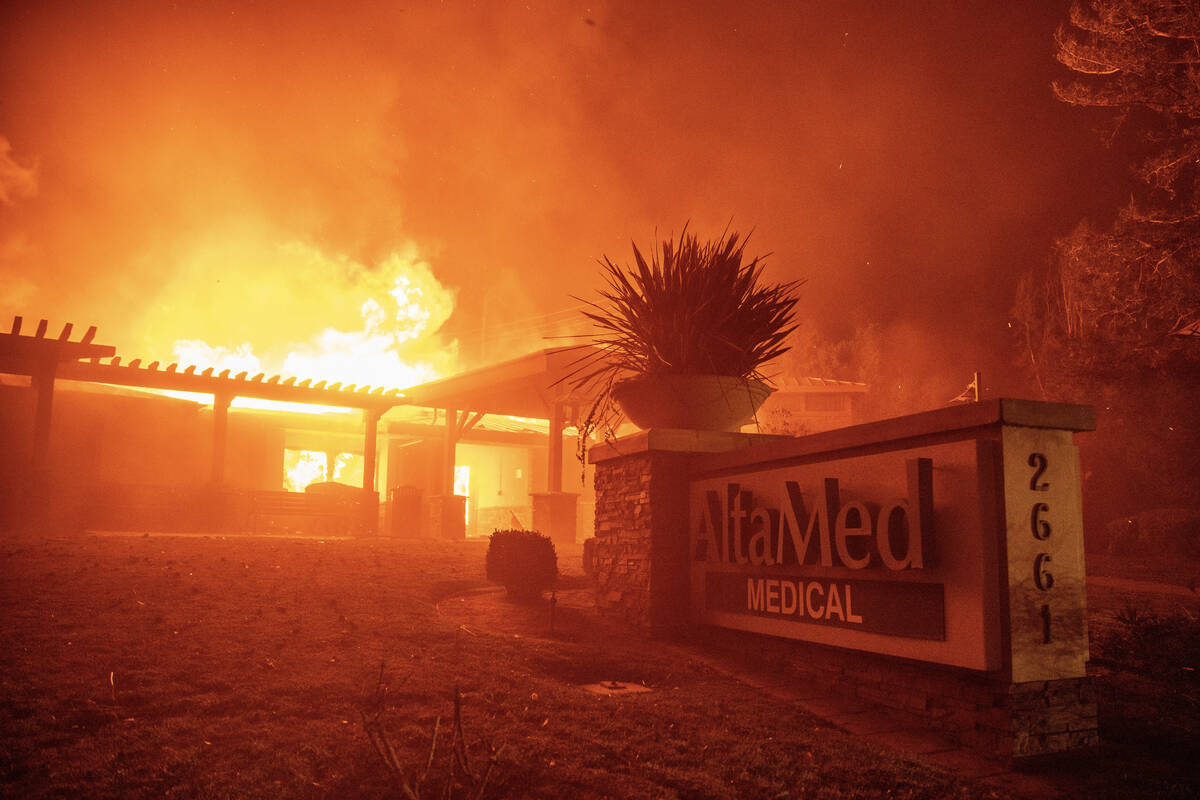 The Eaton Fire burns the AltaMed Medical building Wednesday, Jan. 8, 2025 in Altadena, Calif. ( ...