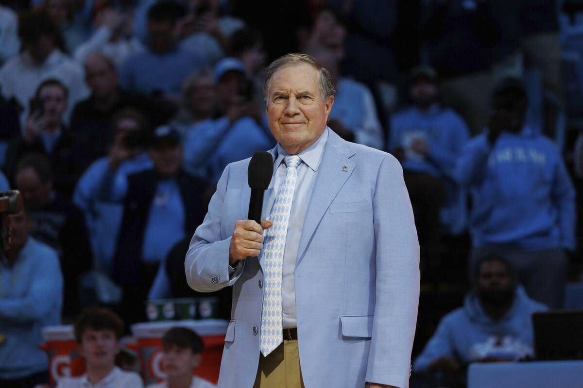 New North Carolina head football coach Bill Belichick speaks to the crowd at Dean Smith Center ...