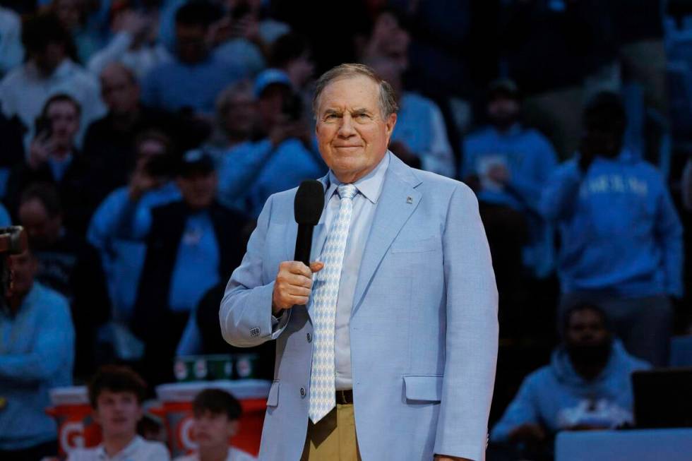 New North Carolina head football coach Bill Belichick speaks to the crowd at Dean Smith Center ...