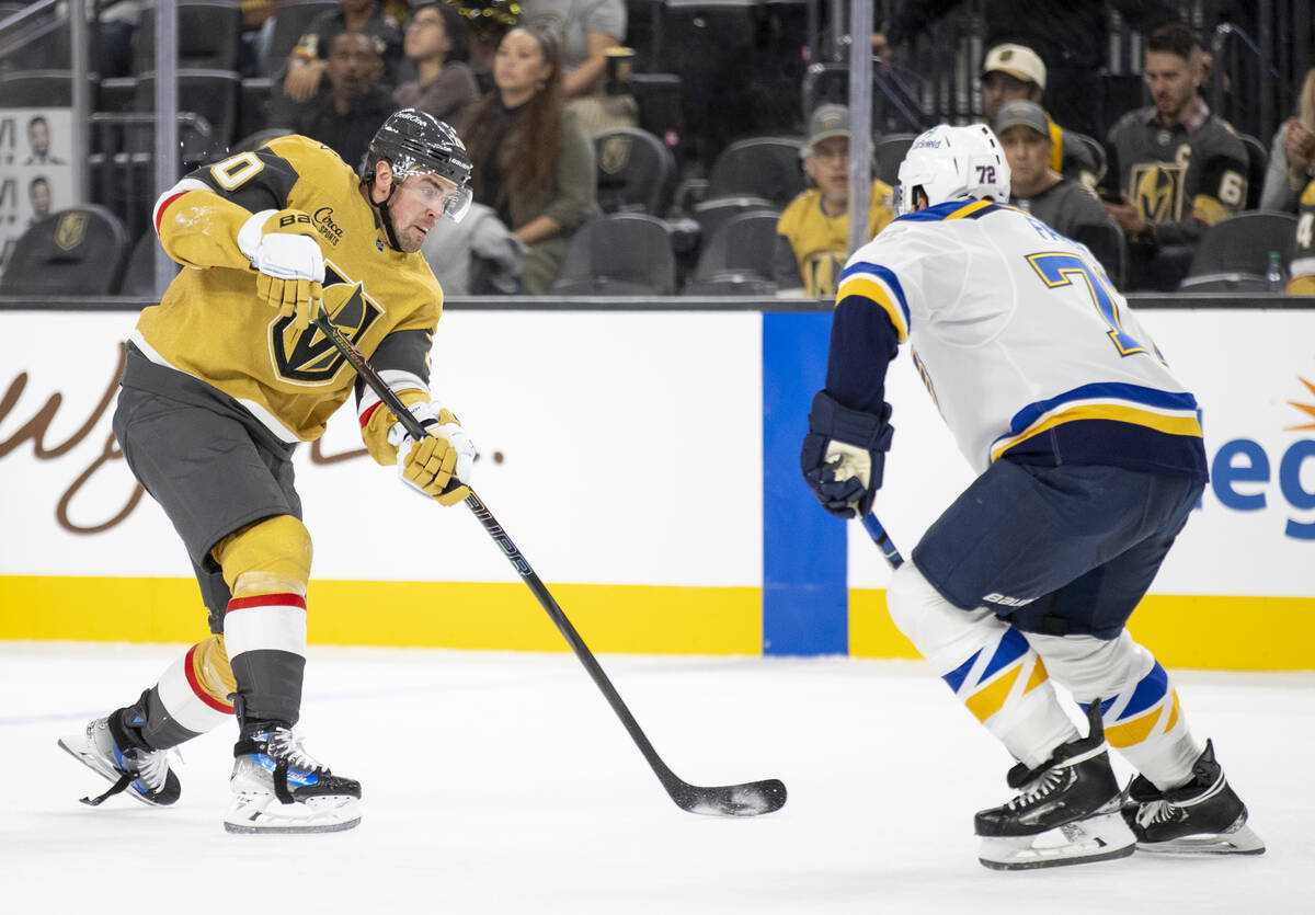 Golden Knights left wing Tanner Pearson (70) looks to shoot the puck past St. Louis Blues defen ...