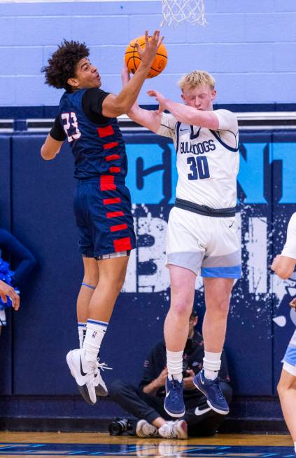 Liberty's Maison Martin (23) and Centennial's Cooper Jenkins (30) battle for a rebound during t ...