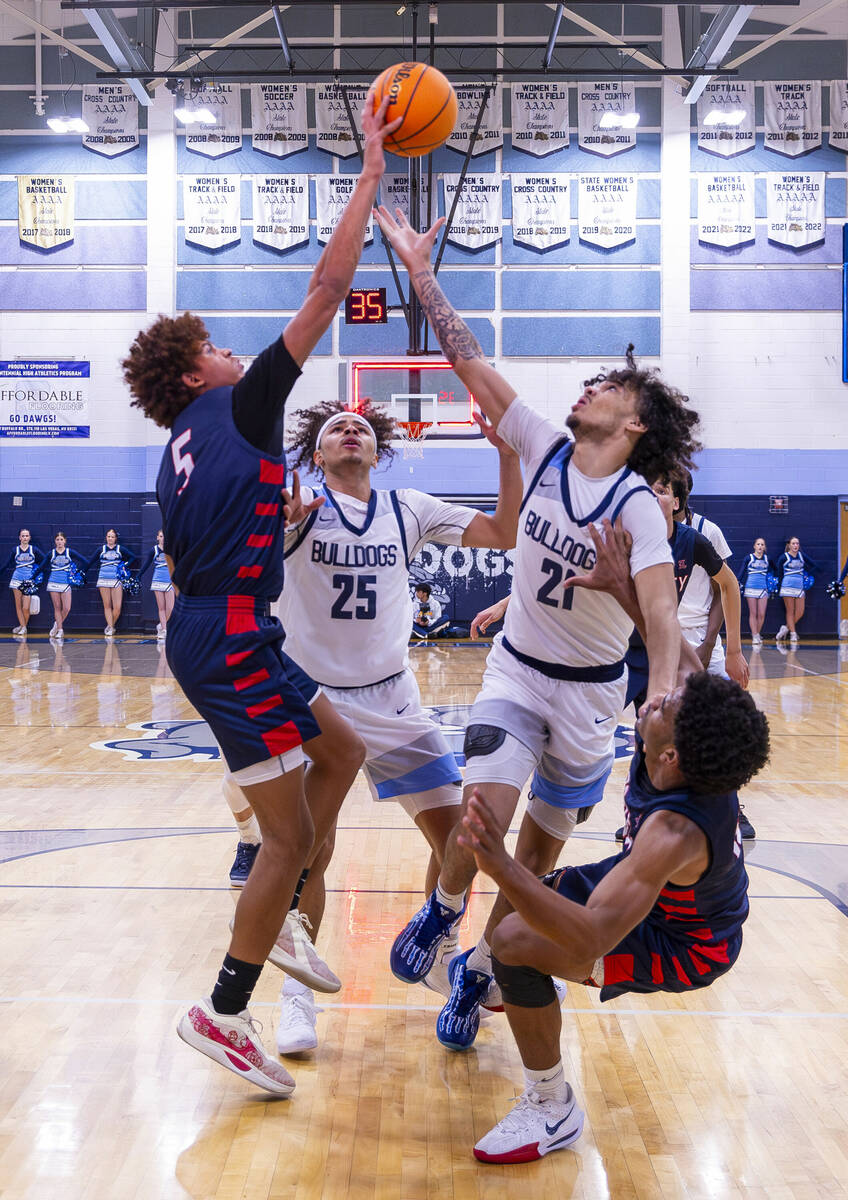 Liberty's Dante Steward (5) battles for a rebound with Centennial's Jayonni Durrough (25) and J ...