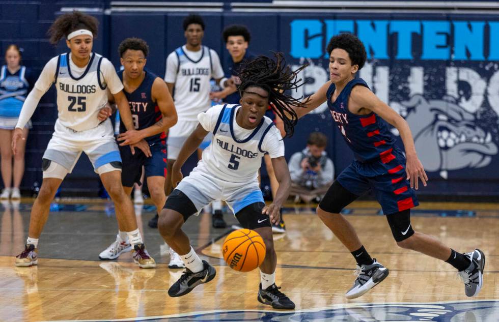 Centennial's Jayden Ceaser (5) chases a loose ball as Liberty's Taytum Cios-Webb (4) moves in d ...